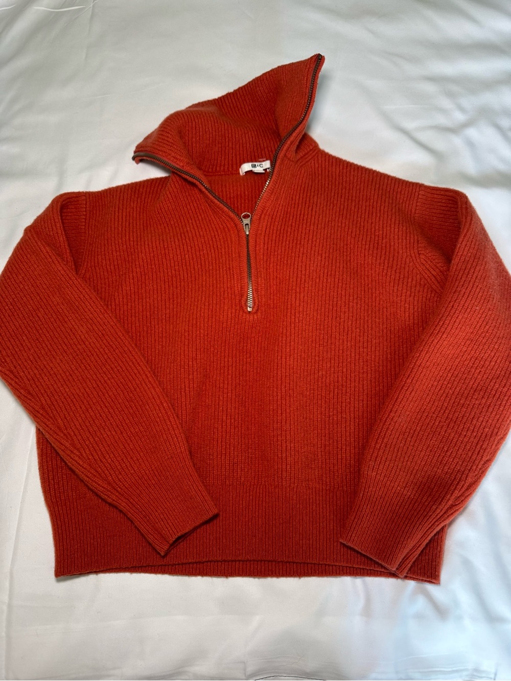 Uniqlo Women's Half-Zip Hooded Sweater in Burnt Orange, cropped.